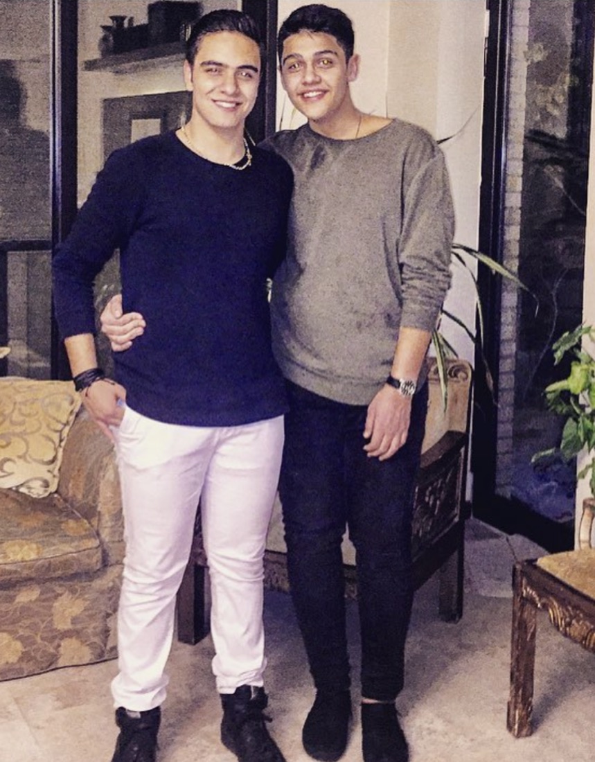 DOSO and Mehrad as young teenagers, arm in arm at home