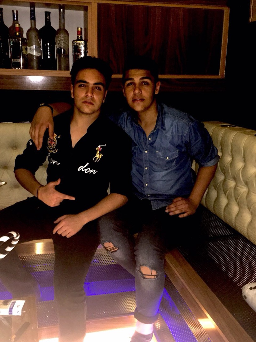 DOSO and Mehrad as teenagers on a lounge banquette